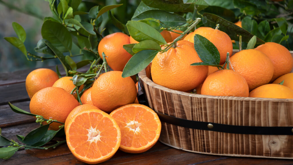 Orange,Fruit,With,Green,Leaves,On,The,Wood.,Home,Gardening.